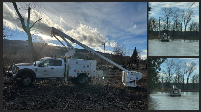 An image of repair vehicles and flooded roads